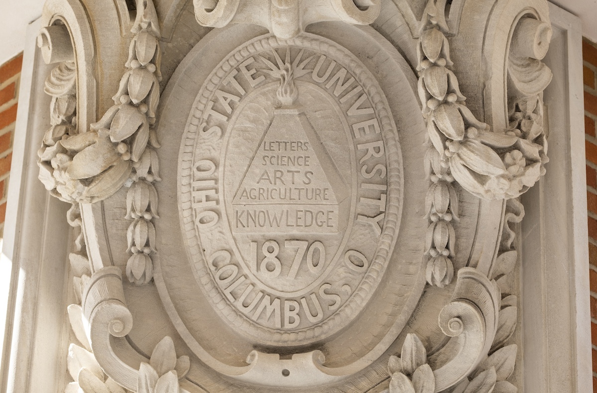 Seal of The Ohio State university etched in stone on Ohio State campus.