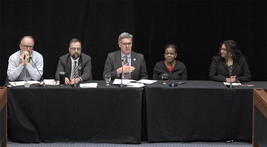 Panelists, five people at a table