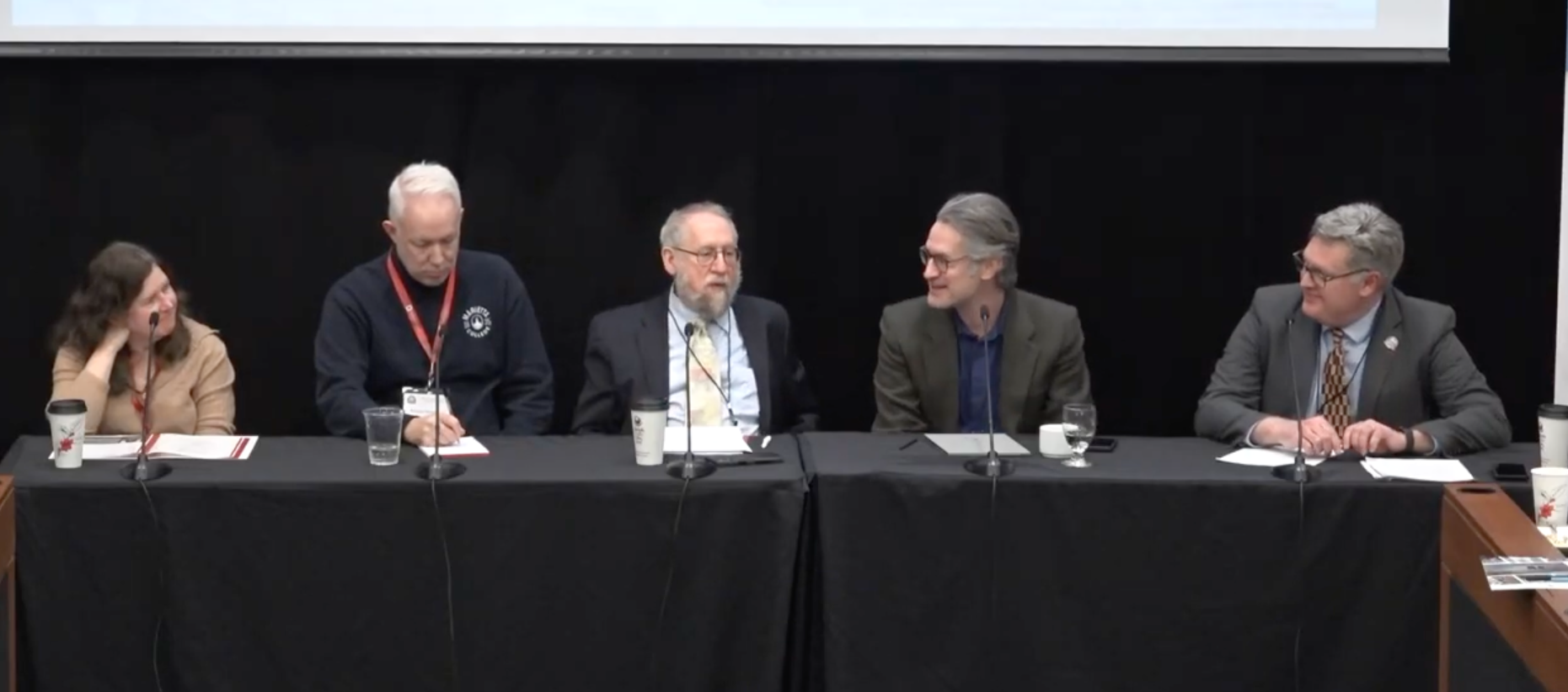 Panelists, five people at a table