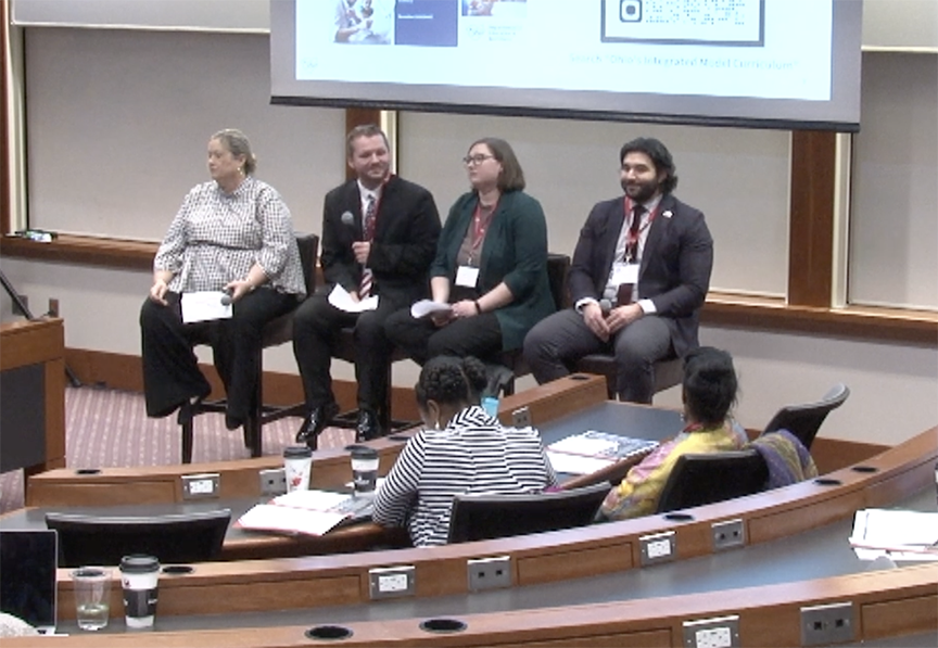 Panel, four people in chairs