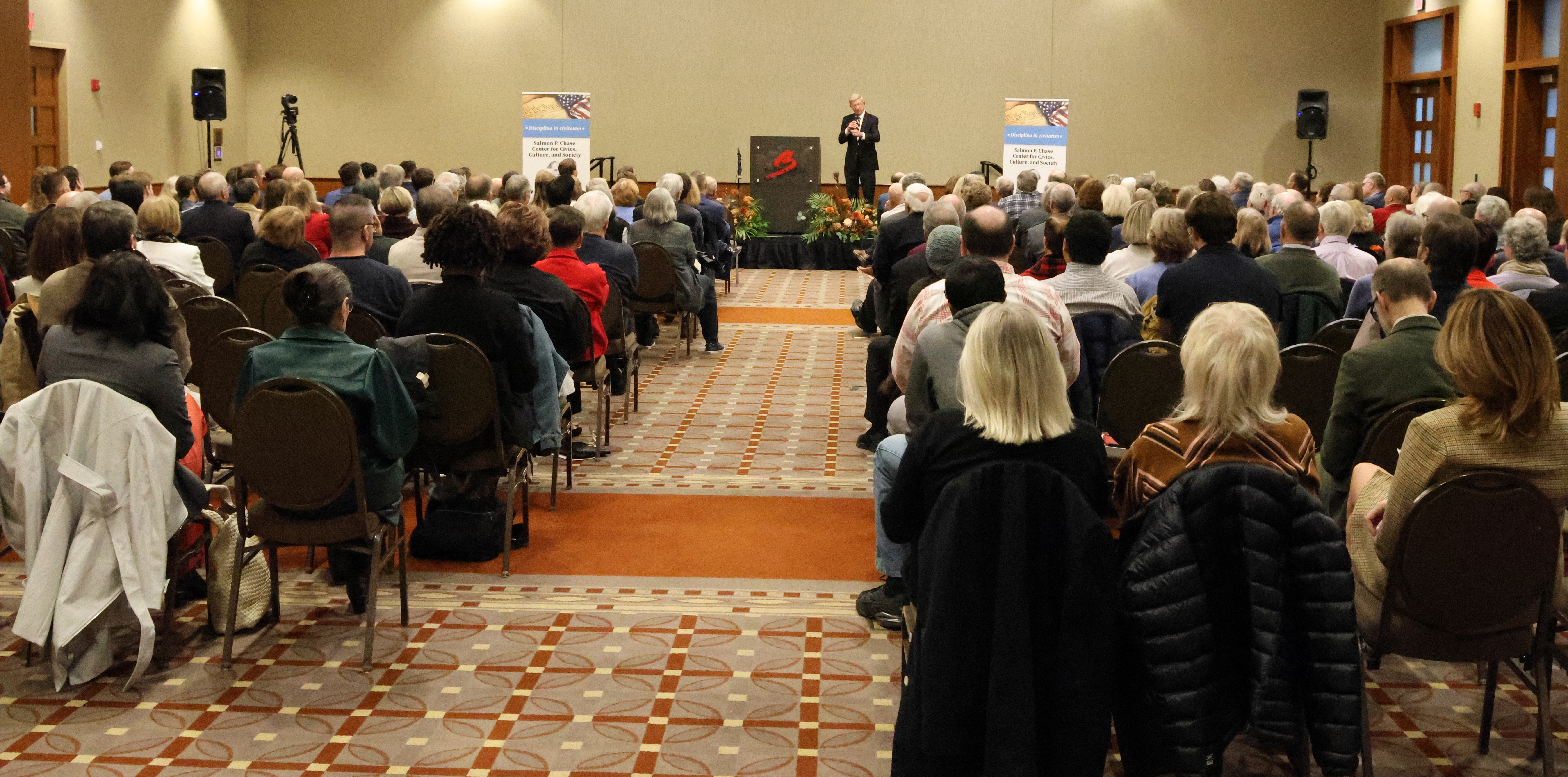 Audience watching a speaker