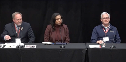 Panelists, three people at a table