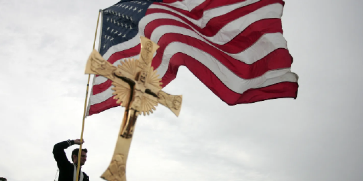 A young man waves an American Flag