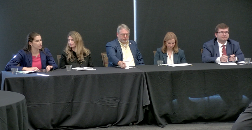 Panelists, five people at a table